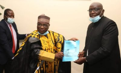 Professor Abdalla Adamu, left, hands over to Professor Olufemi Peters at NOUN