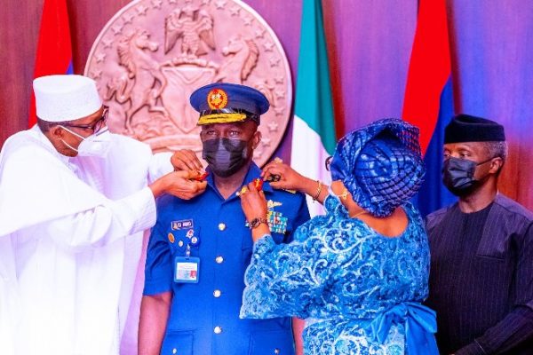 President Buhari decorates new service chiefs, promises support