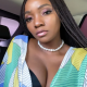 Check out Adekunle Gold's reaction as Simi exposes cleavage in pictures