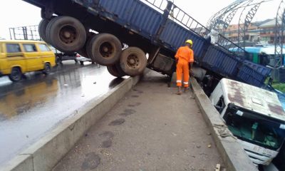 Lagos: Many escape death as Truck falls off Oshodi Bridge-TopNaija.ng