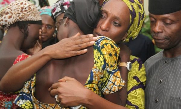 The vice-president, Yemi Osinbajo, right, looks on as his wife, Dolapo, comforts one of the 21 girls from Chibok kidnapped by Boko Haram in 2016. Photograph Philip Ojisua AFP Getty