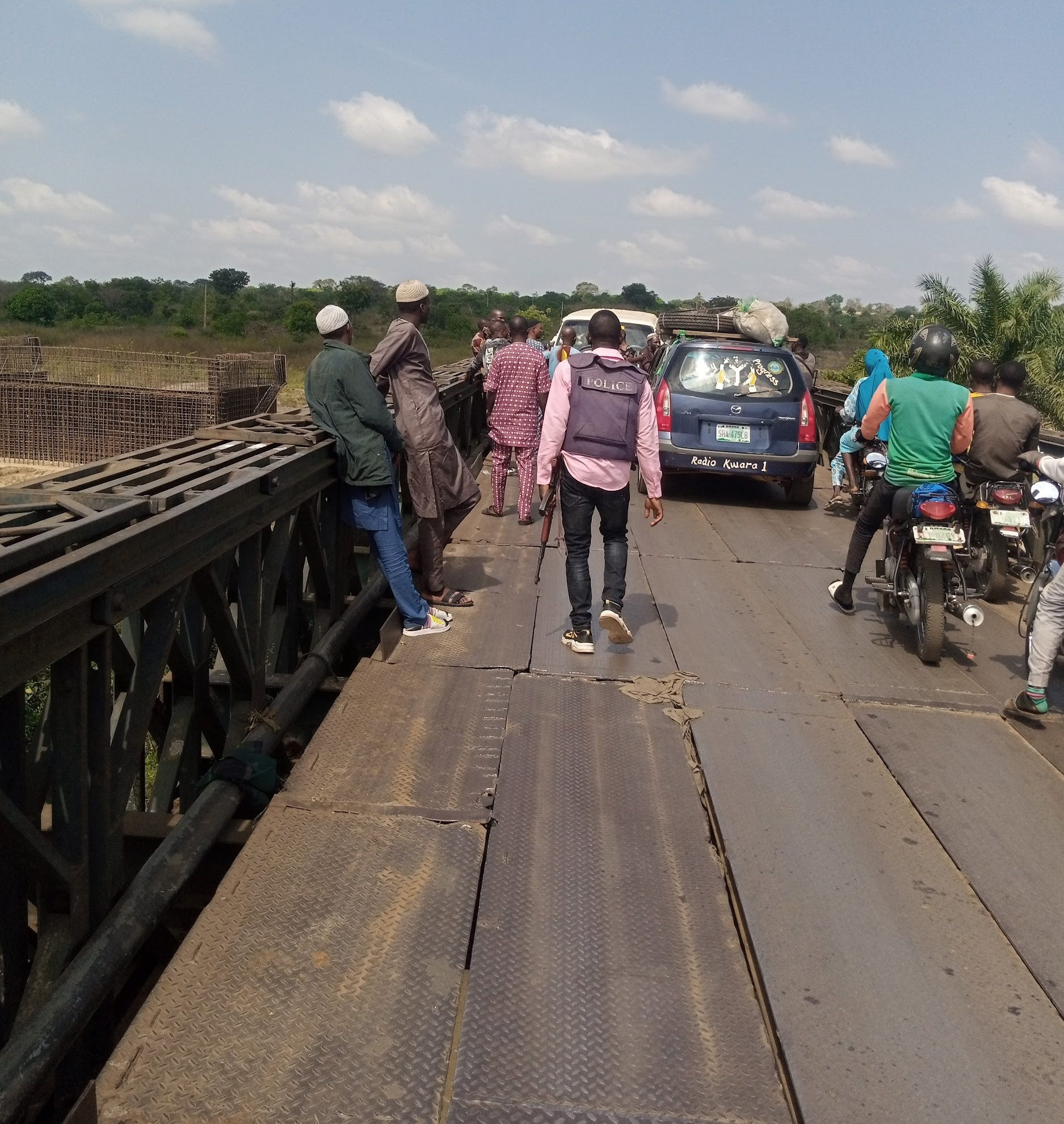Container falls on vehicle conveying woman and her three children in Kwara