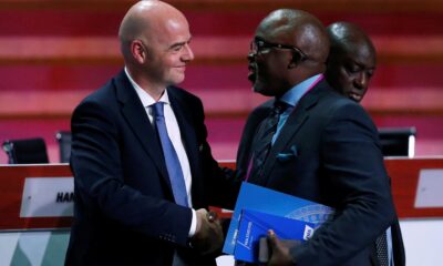 FIFA President Gianni Infantino speaks with Amaju Melvin Pinnick, President of the Nigeria Football Federation (NFF), during the 66th FIFA Congress in Mexico City