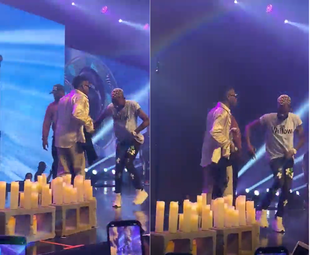 wizkid dances with fan on stage