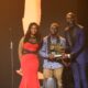 Dr Ola Brown (left) and Mai Atafo (right) presenting The Future Awards Africa Prize for Entrepreneurship to Jerry Mallo