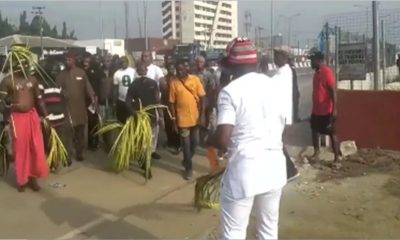 Protesters storm INEC office, native doctor performs ritual (Video)
