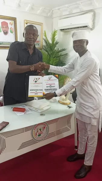 Mr William Moses, National Organising Secretary , Young Progressives Party (YPP)presenting Nomination and Expression of Interest Forms to Mr John Akinmurele in Abuja